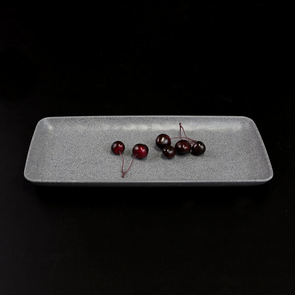 An Elite Global Solutions rectangular granite stone melamine plate with cherries on it.