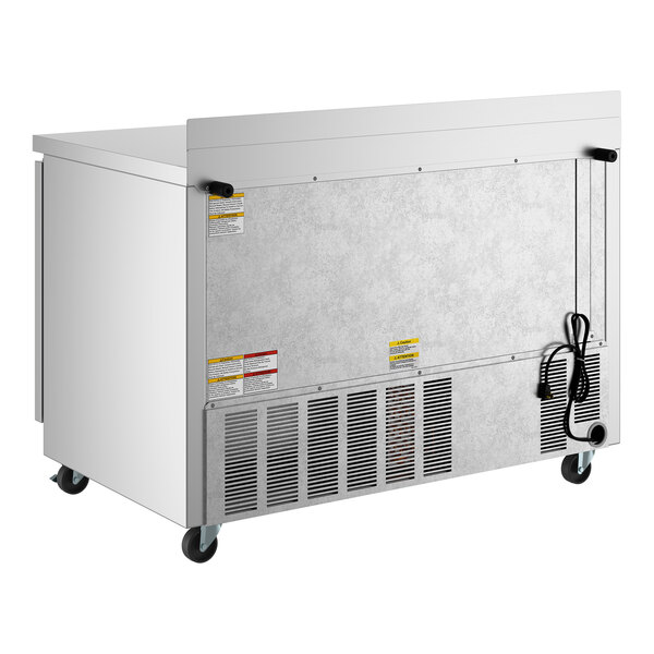 A stainless steel two-door ADA-height worktop refrigerator on casters with a rear ventilation panel and power cord.