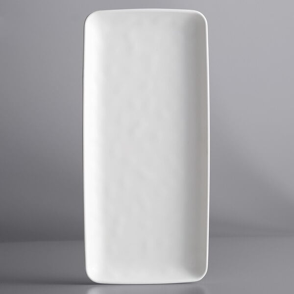 A white rectangular plate with a white rim.