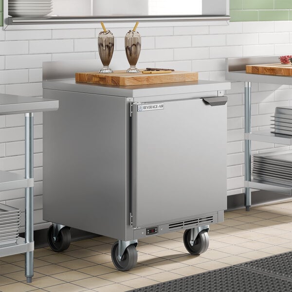 A stainless steel single door, left-hinged worktop freezer on casters with a flat top surface, made by Beverage-Air.
