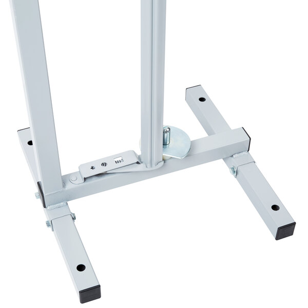 A white metal stand with black legs.
