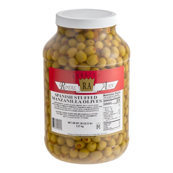 A large plastic jar filled with Spanish stuffed Manzanilla olives.