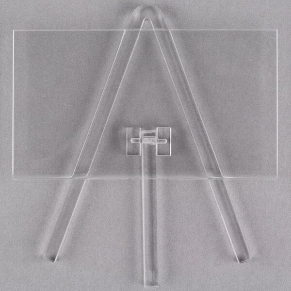 A clear acrylic Tablecraft easel with a triangle base.