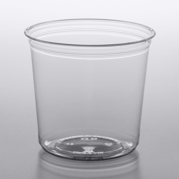 A Fabri-Kal clear plastic deli container on a white surface.