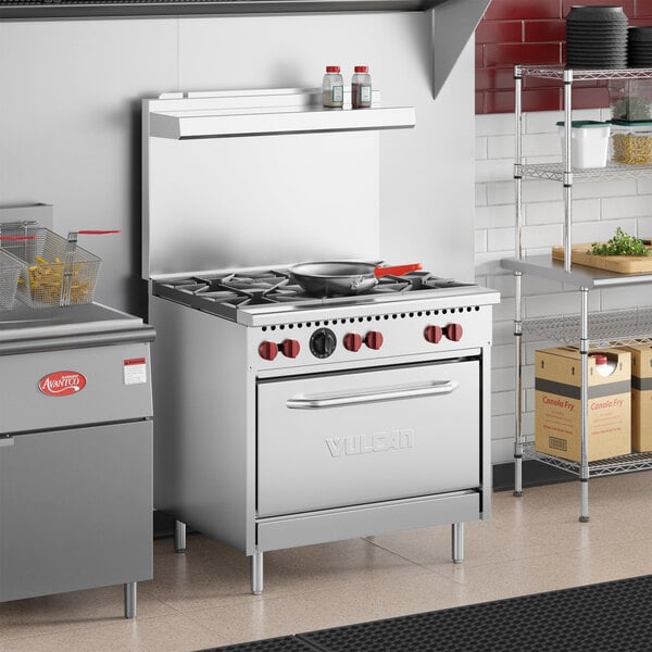 A stainless steel Vulcan SX36-6BP commercial range with six burners and a standard oven.