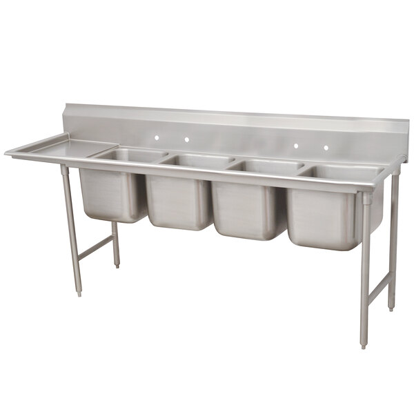 An Advance Tabco stainless steel four compartment sink with one drainboard on the left.