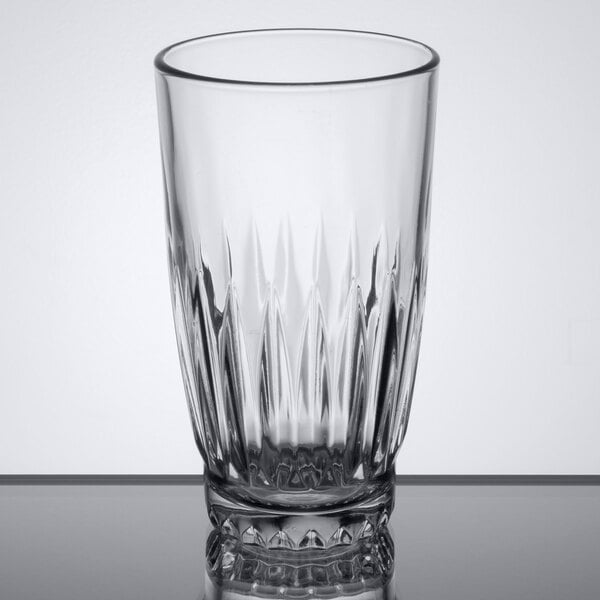 A close-up of a Libbey Winchester clear glass with a patterned design.