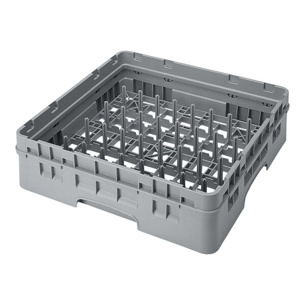 A gray plastic peg rack with a grid of vertical pegs, designed for holding dishware during washing.