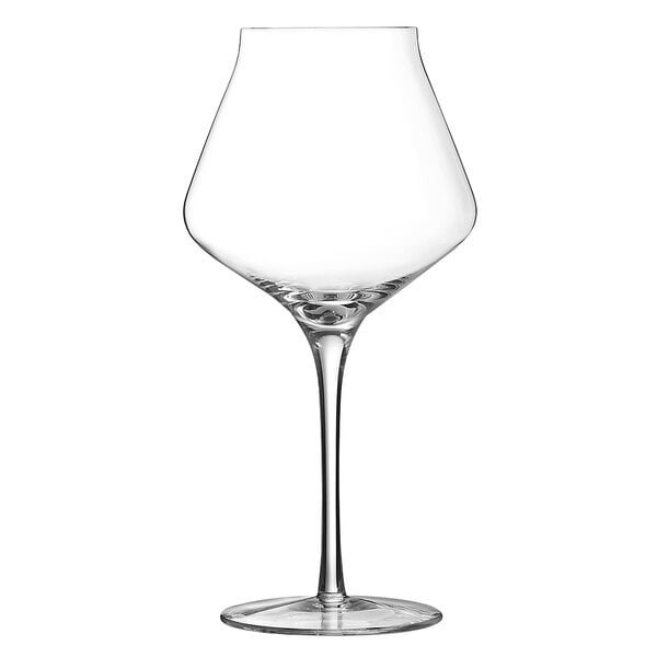 A close-up of a clear Chef & Sommelier wine glass with a stem.