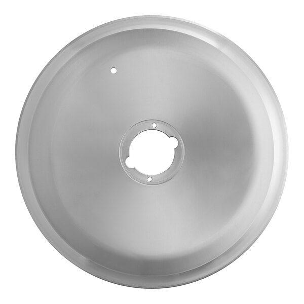 A circular metal object with a hole in the center.