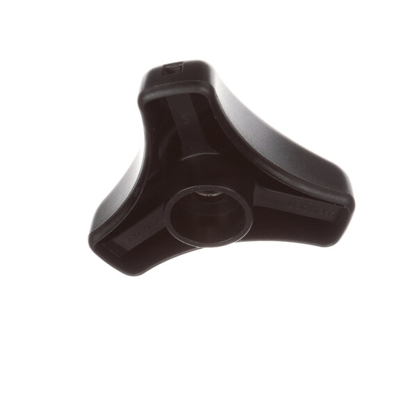 A black plastic Wascomat door knob with a hole in it.
