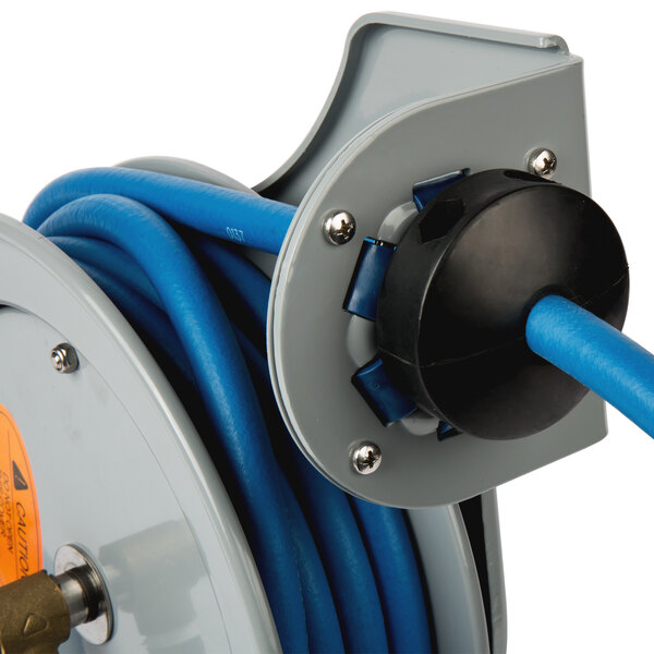 A T&S hose reel with a blue and black hose on it.
