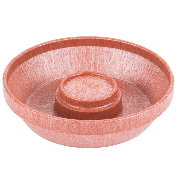 A red plastic bowl with a round center.