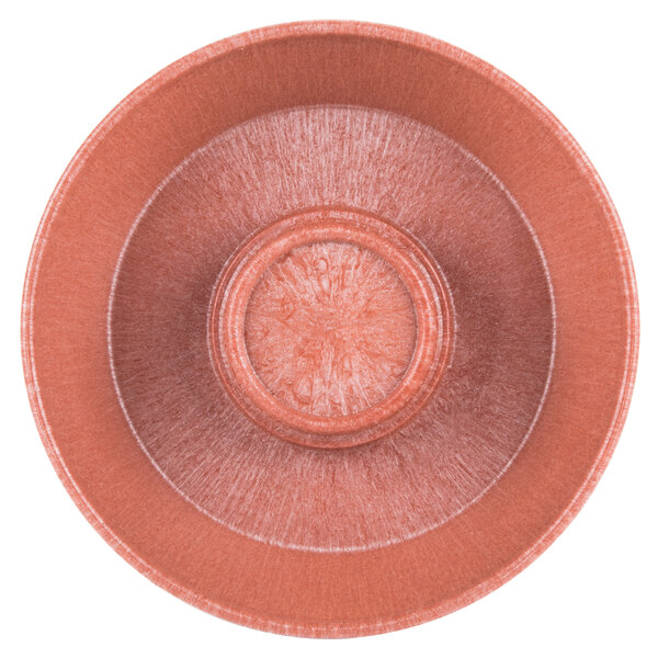 A close-up of a red polyethylene chip server bowl.