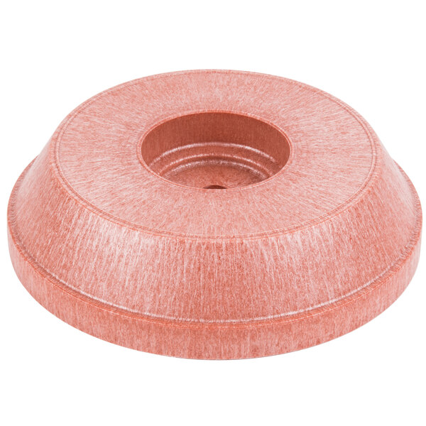 A round pink polyethylene chip server with a hole in it.