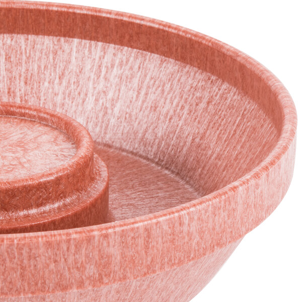 A red polyethylene bowl with a handle.