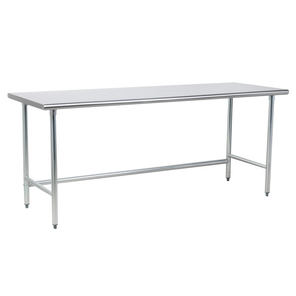 A long silver rectangular Advance Tabco stainless steel work table with metal legs.