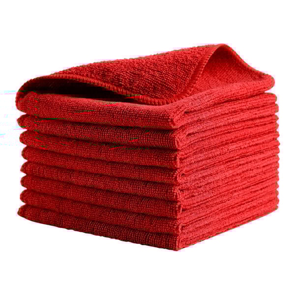 A stack of pink Rubbermaid microfiber cloths.