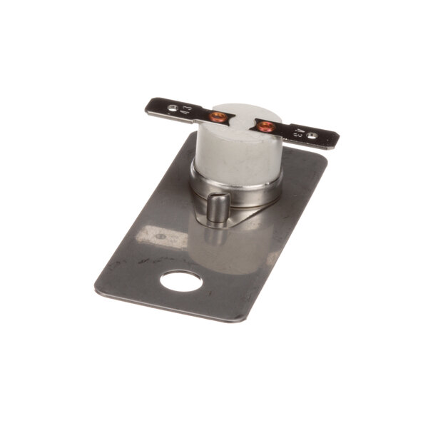 A metal plate with a white cylinder attached to it.