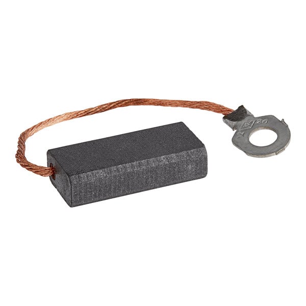 A rectangular black carbon brush with copper wire and a metal ring.