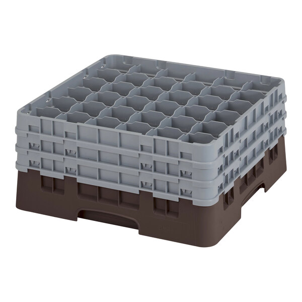 A brown and grey plastic Cambro glass rack with several compartments.