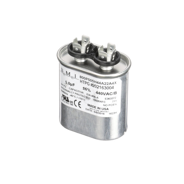 A silver ColdZone capacitor with black and white text on it.