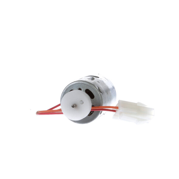 A small electric motor with red wires.