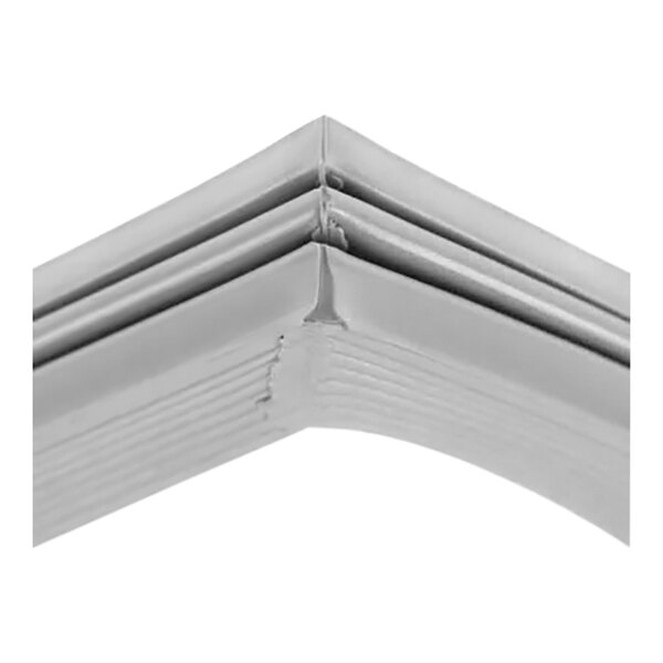A close up of a white magnetic door gasket corner.