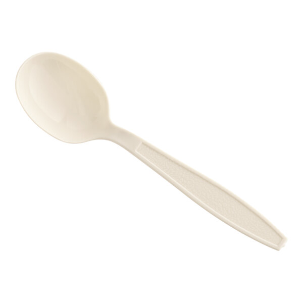 A beige heavy weight plastic soup spoon.