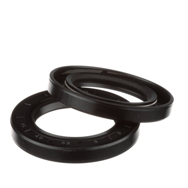 A close-up of two black General oil seals.