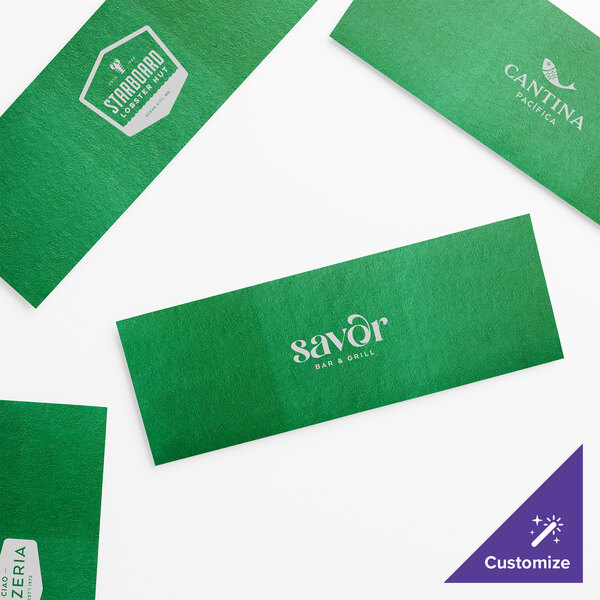 A group of green self-adhering paper napkin bands with white customizable rectangles.