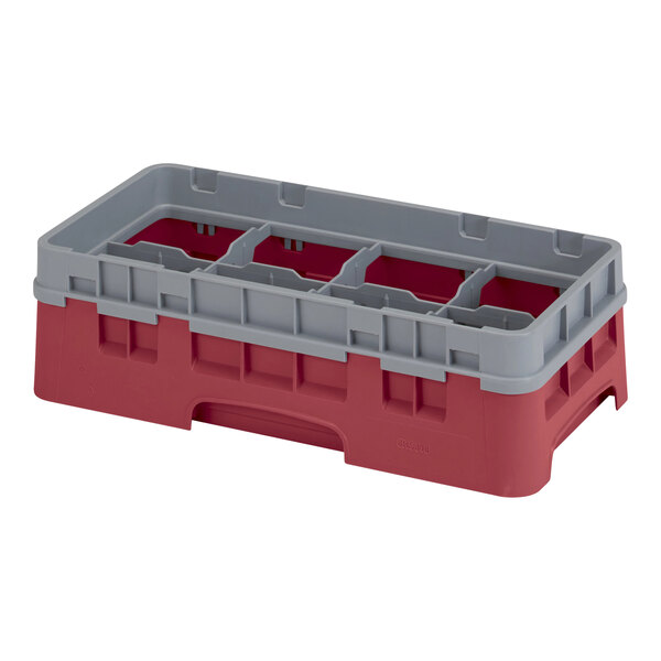 A red and gray plastic Cambro glass rack with four compartments.