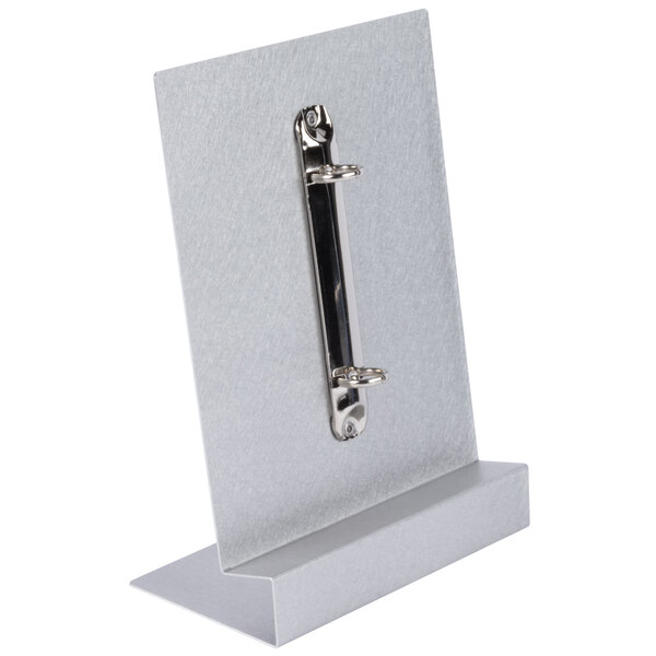 A brushed silver aluminum Menu Solutions menu tent with a metal clip.