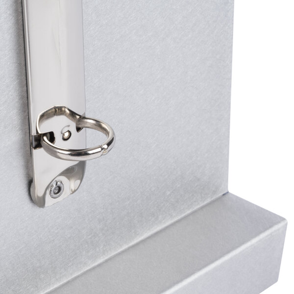 A brushed aluminum Menu Solutions table tent with a keyhole.