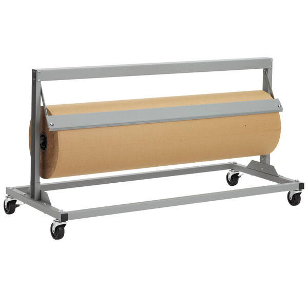 A Bulman jumbo paper cutter with a roll of paper on a metal rack.