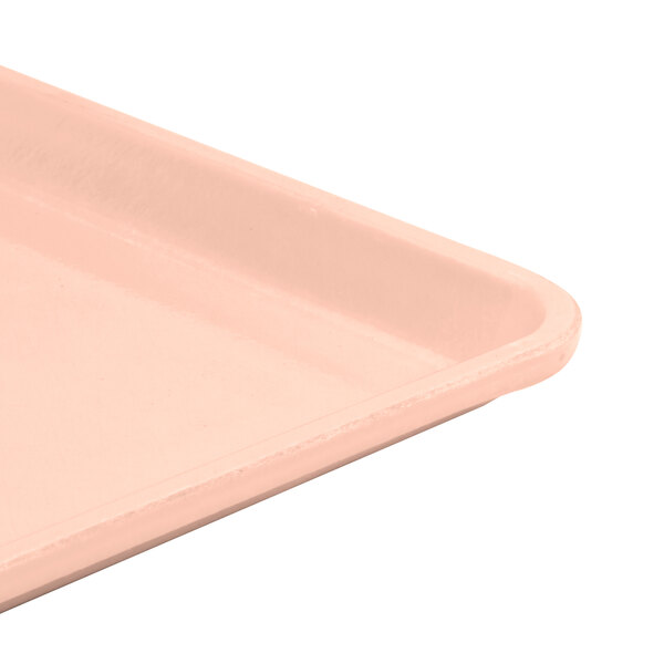 A light peach Cambro dietary tray with a handle.