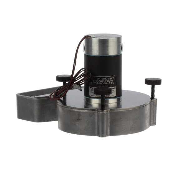 A small round metal object with a black cylinder and a black cord.