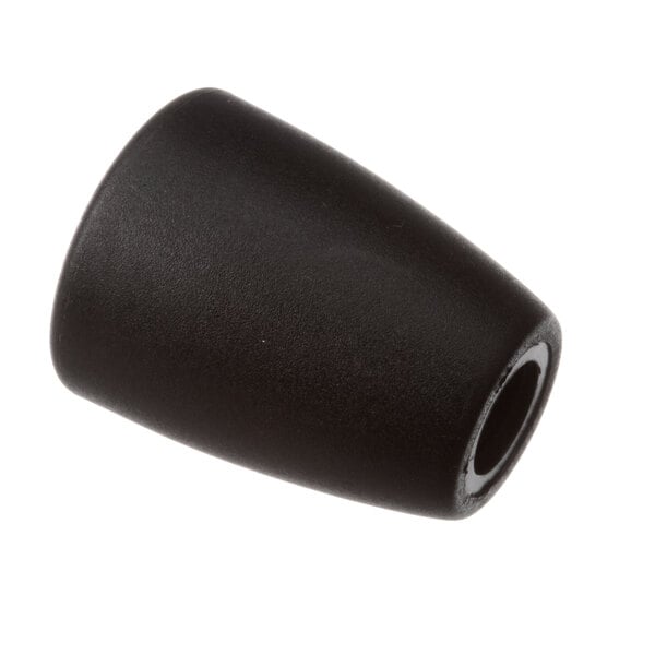 A close up of a black rubber knob with a hole in it.