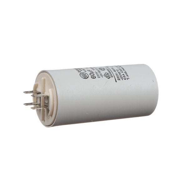 A white round Electrolux capacitor with black text.