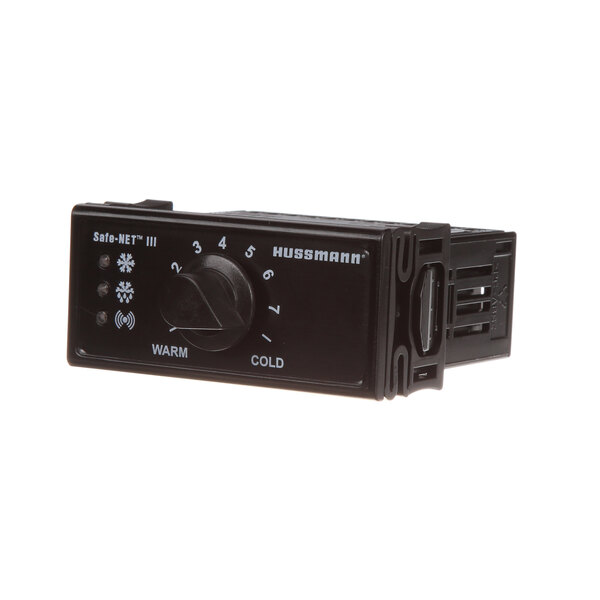 A black electronic controller with knobs and dials.