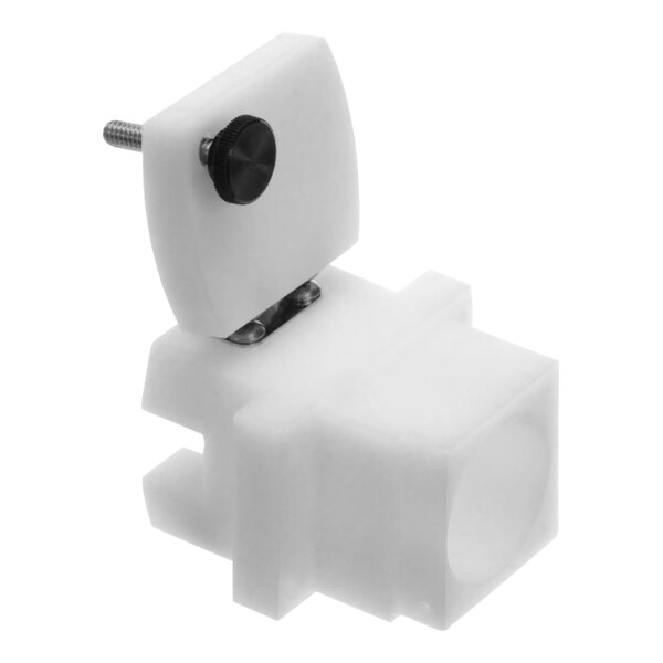 A white plastic block with a black knob.