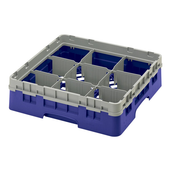A navy blue plastic Cambro glass rack with 9 compartments.