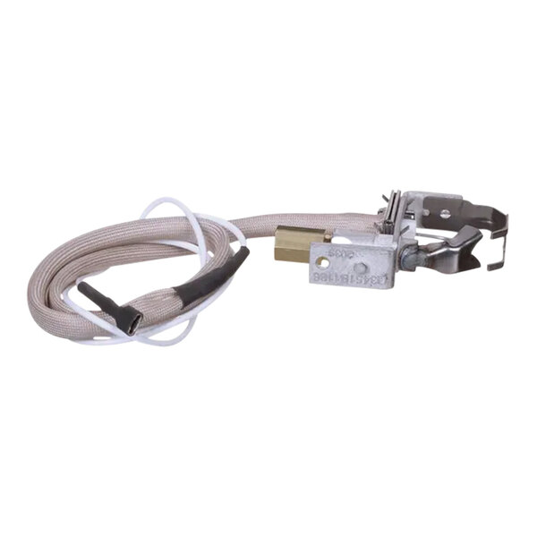 A white cable with a metal connector and a wire attached to a State Water Heater natural gas pilot burner/ignitor assembly.
