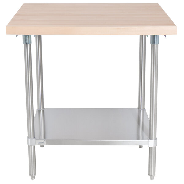 An Advance Tabco wood top work table with a stainless steel base and undershelf.