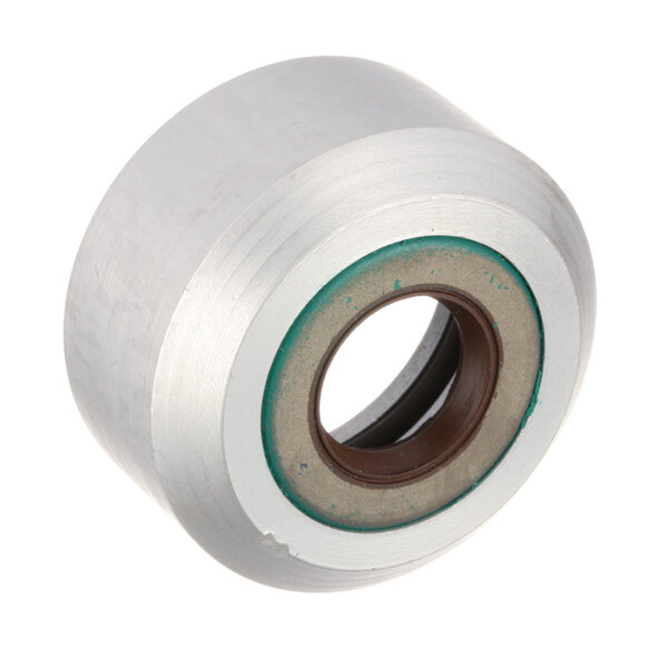 A white and green rubber roller with a hole in it.