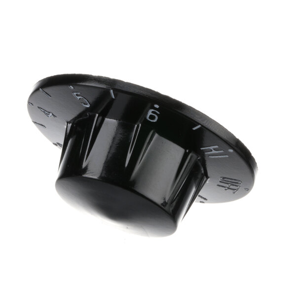 A close-up of a black plastic Servolift knob with numbers.