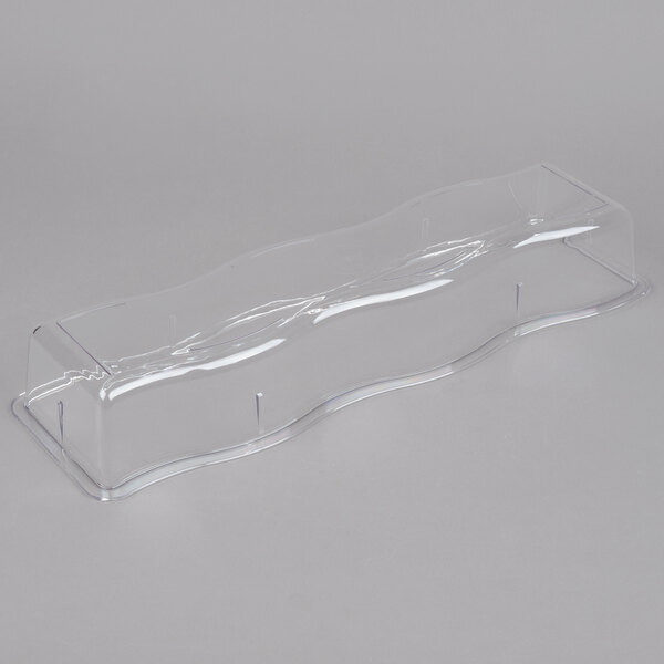 A Carlisle clear plastic wavy edge food pan on a white background.