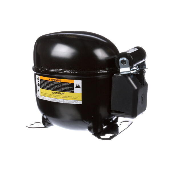 A black Everest Refrigeration compressor with a yellow label.