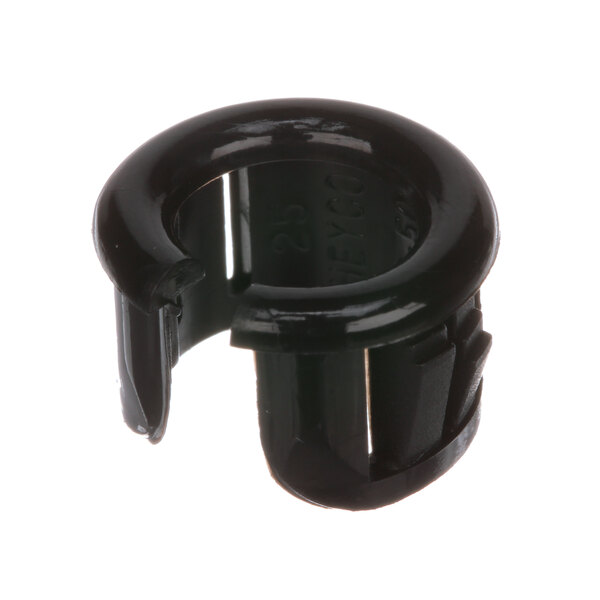 A black plastic Berkel bushing with a hole in it.