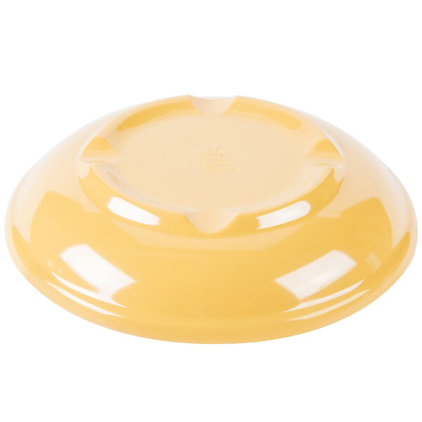 A tropical yellow melamine bowl with a diamond pattern on it.